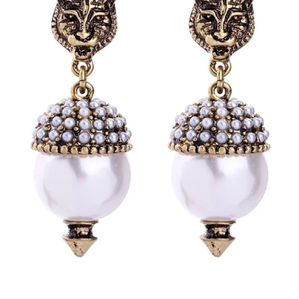 Feline earrings luxury pierced.

.5 inches wide and 1.5 inches long
